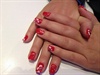 Red nails with white flowers