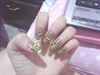 yellow nail polish w/ black stripes