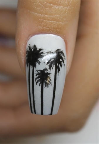 The ombre gray background is made using a makeup sponge, dabbing the color so it fades. Palm trees are hand painted.