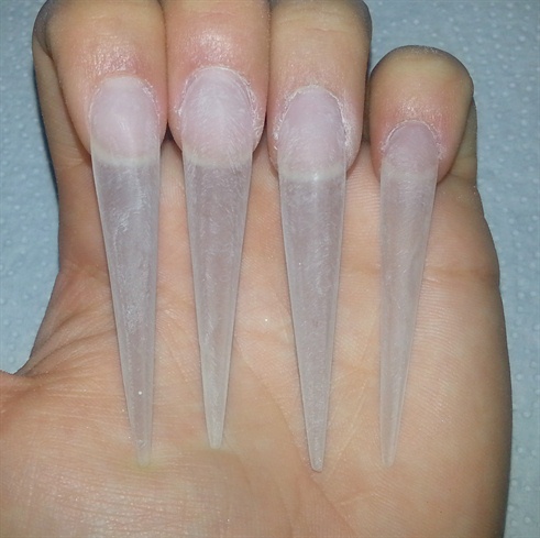 I sculpted with acrylic and gave stiletto shape, then I  buffed my nails so i could start my painting