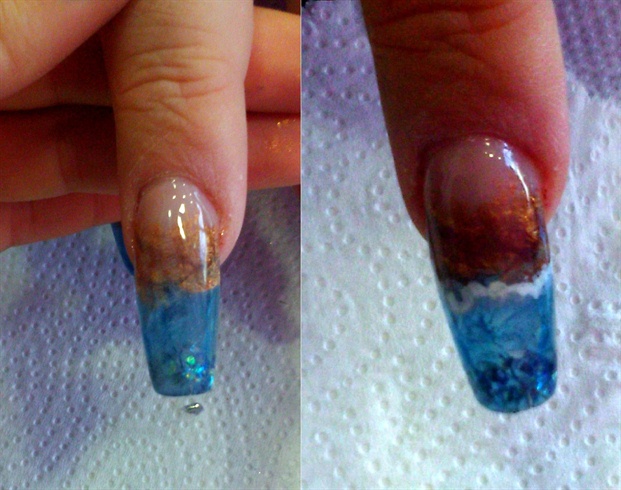 I enclosed the whole nail enhancement with clear acrylic powder and filed it smooth, finishing with a buffer. I then used some white acrylic paint to make the wave foam by tapping lightly with a very thin brush and watering the paint to give a fading effect.
