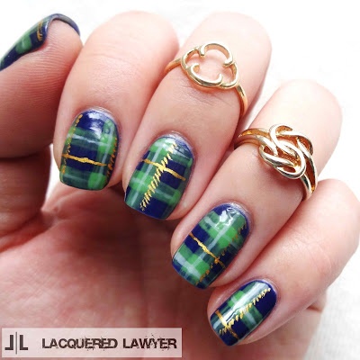 4.Use gold polish to add a solid horizontal line between the green stripes.  On the right side of all the horizontal green stripes, add a dashed line.  These nail look great like this without the embellishments too.