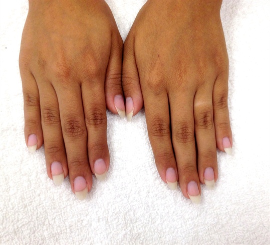 Prepare the natural nails by doing cuticle work, and shaping.  