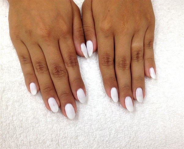 Begin with a thin coat of white gel polish.  It does not have to be perfect coverage because most of it will be covered.  Plus, this will keep the nails nice and thin.  