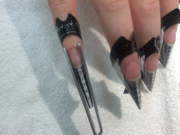 Use a magic want to pinch the nails so they have a nice narrow shape.  