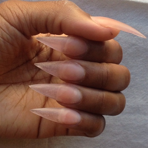 Here I sculptured stiletto shaped nails with CND retention acrylic line, filed, and buffed the nail with a 180 grit buffer. 