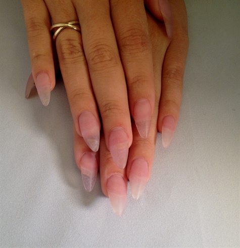 First I cleaned and prepped the natural nails. Then using young nails forms and CND Acrylic system I sculpted this set of nails into an almond shape.