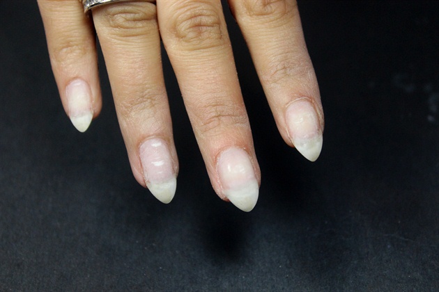 Prep natural nails for gel polish application.