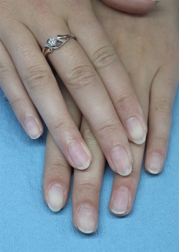 Clean and prep natural nails for gel polish application.