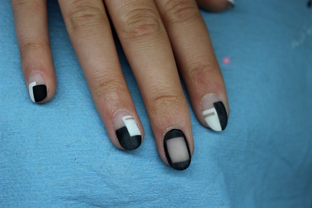 Remove tacky layer and buff to make sure nails are completely smooth and even.
