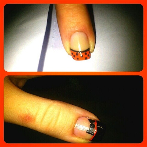 Paint in your orange nails black polka dots and in the black ones orange bows.