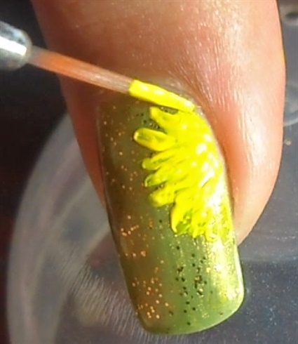 Start drawing the petals in yellow acrylic paint