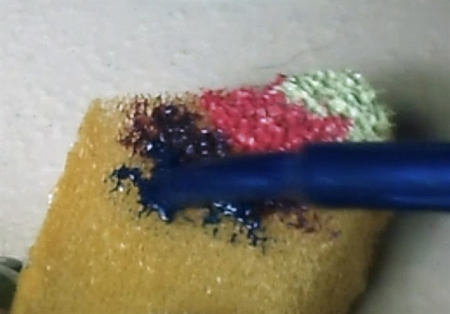 Apply the nail polishes to a sponge