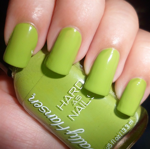 Apply base coat then paint your nails green.
