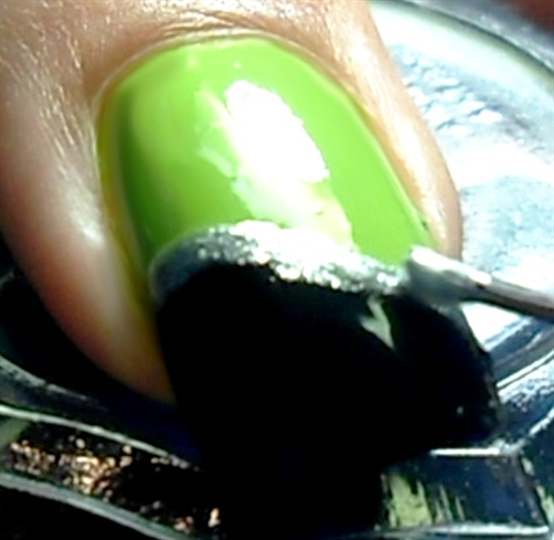 Outline the black shape with silver nail polish