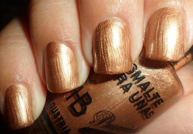 Apply Base coat to protect your natural nails then paint all your nails bronze.