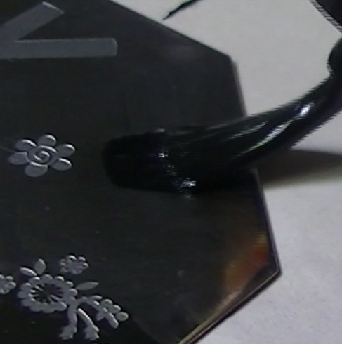 Apply black polish over the flower design on the stamping plate