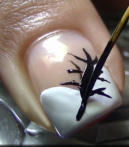 Draw a tree with several branches with black nail polish and a striper brush
