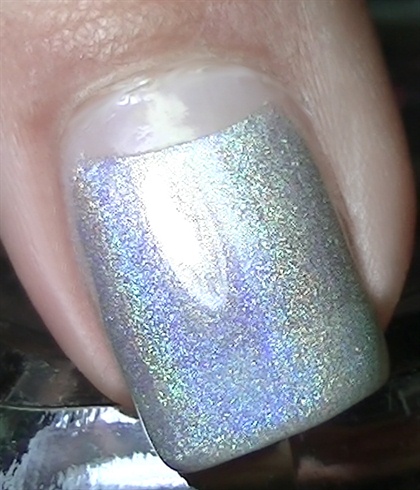 Apply base coat then paint your nails using a holo polish as shown