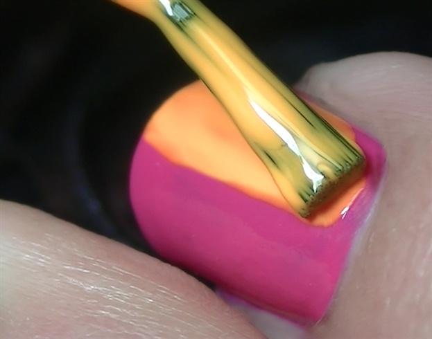 Start by color blocking your nails by painting half of the nail in a different color.