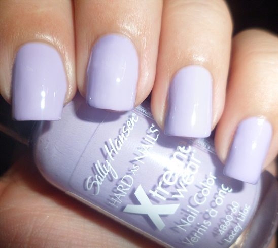 Apply base coat then paint your nails lilac