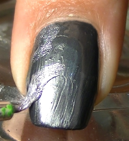 Start by painting with a sparkly silver nail polish randomly.