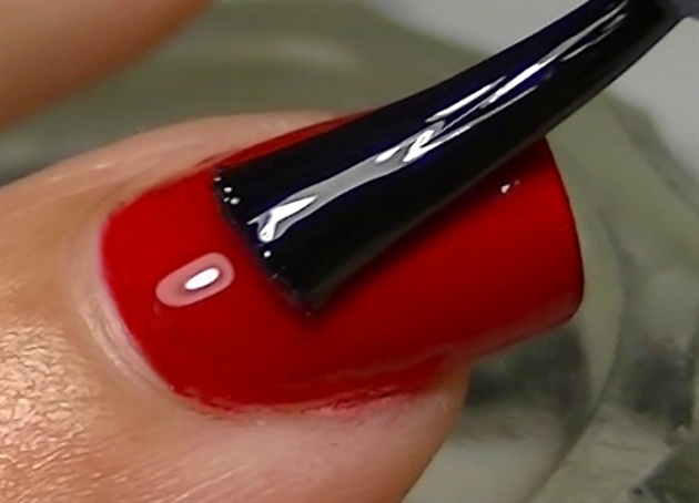 over the red nails, apply a coat of top coat