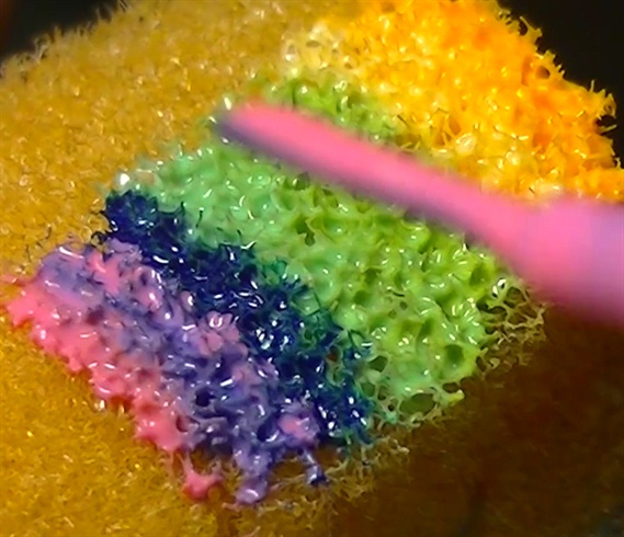 Apply from 3 to 6 colorful nail polishes to a sponge.