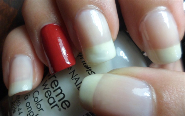 Apply base coat then paint your nails in a natural color. (Paint accent nail in red)