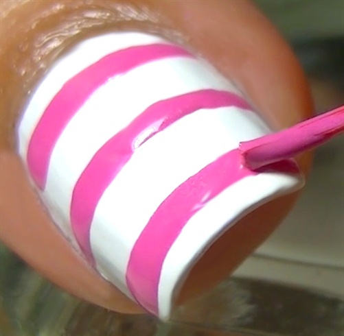 Draw 3 horizontal lines in pink nail polish