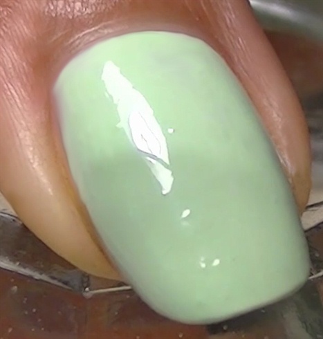 Apply base coat to protect your natural nails then paint mint.