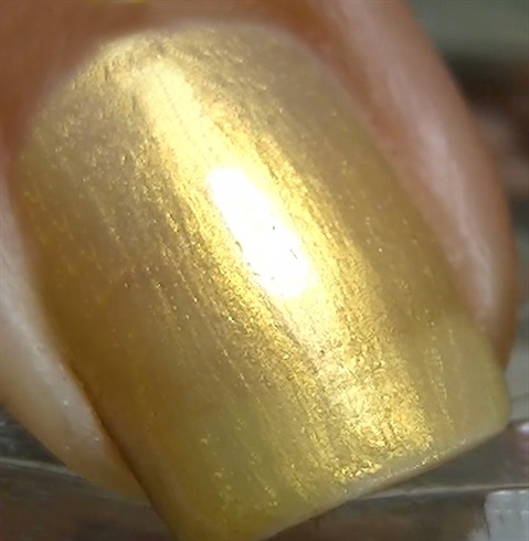 Apply base coat to protect your natural nails then paint golden yellow.