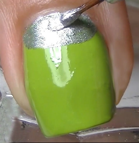 Paint the half moon in silver nail polish with a nail art brush.