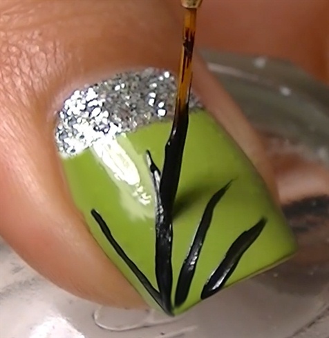 Create 4 lines using a liner brush for the cobweb.