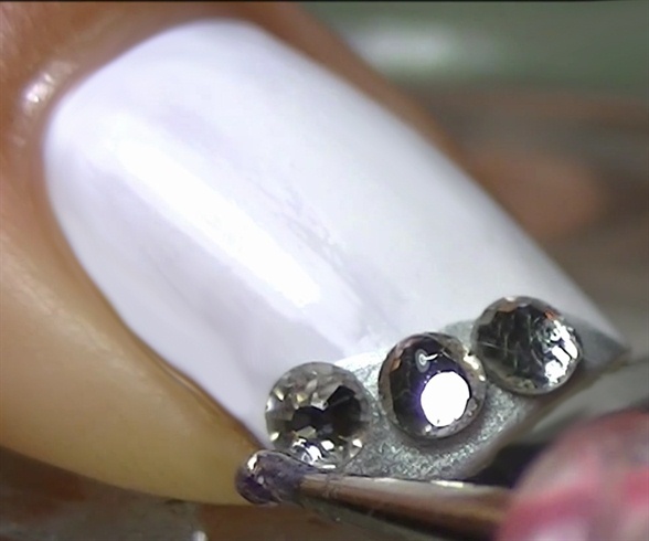 Add 3 beautiful crystals using clear polish or nail glue