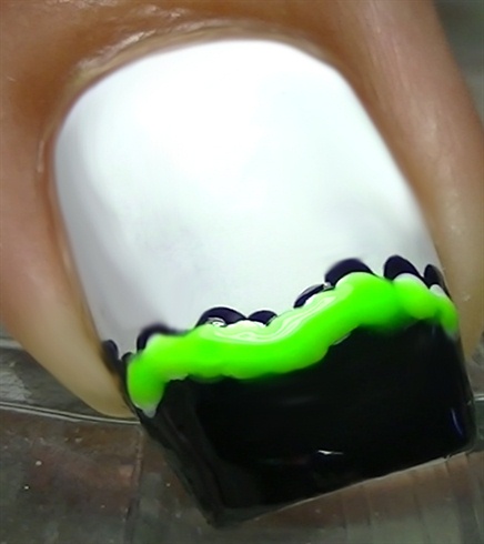 Apply some green glow in the dark nail polish :D