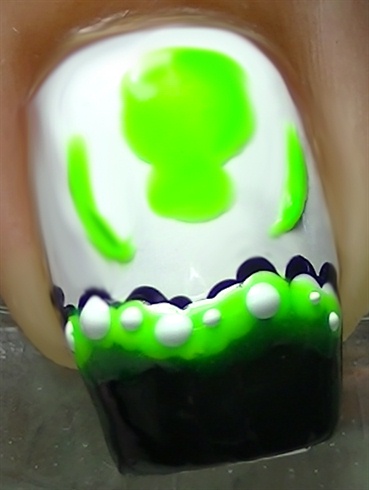Add some white dots over the green polish