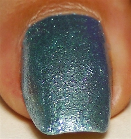 Apply base coat to prevent your nails from staining and  paint your nails using a light blue metallic nail polish