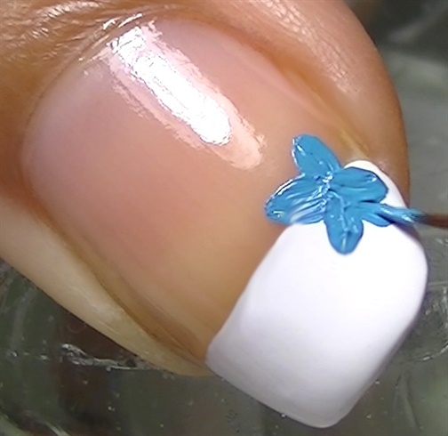 Create flowers using light blue acrylic paint