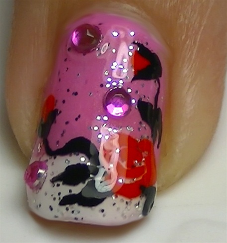 Add a layer of a non-fast dry top coat and add some pink rhinestones