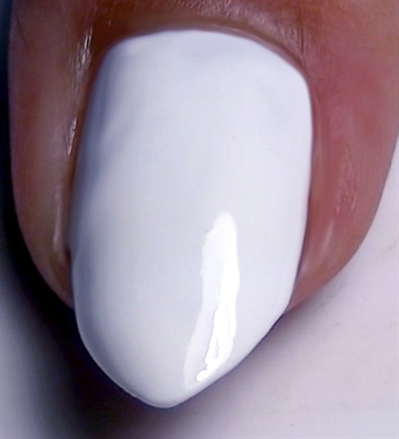 Apply base coat to protect your natural nails then paint your nails white.