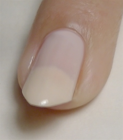 Apply base coat then paint index and accent nails nude