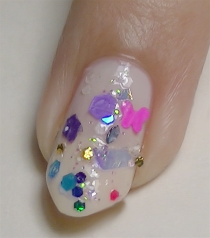 Apply a colorful glitter mix using clear polish