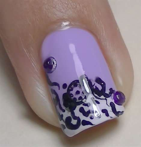 place purple rhinestones and nails are done! :D