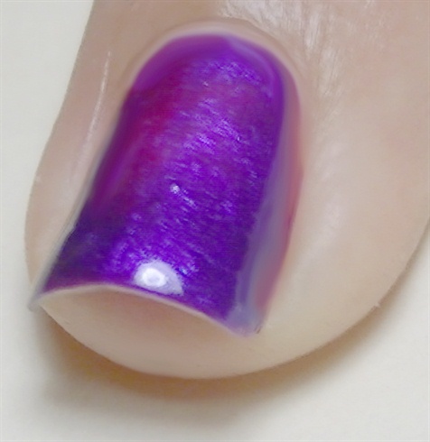 Apply base coat then paint your nails purple