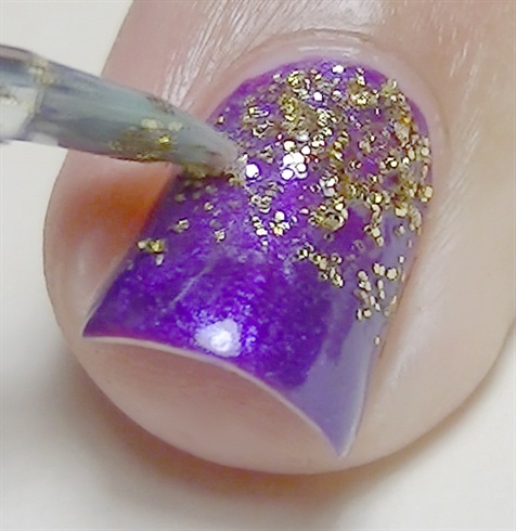 Add fine glitter using a flat brush and clear polish to act as glue