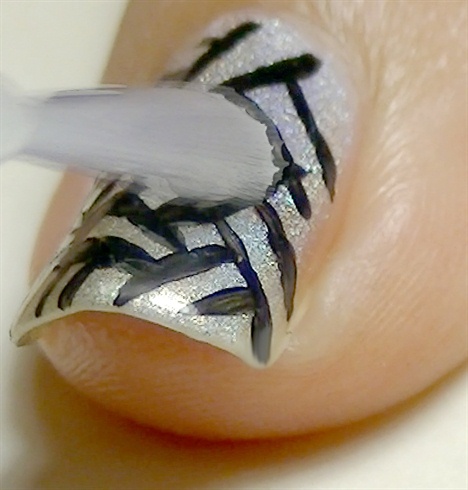 Seal your nail art design with top coat and nails are done!