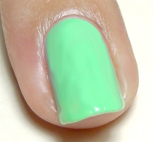 Start with your base coat then paint your nails mint