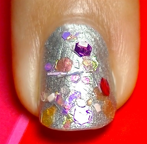 Using clear polish and a flat brush apply a glitter mix