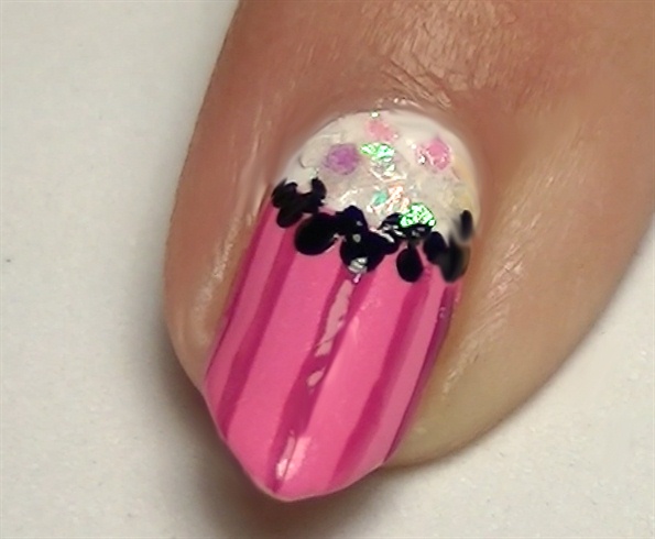 Create black dots to make the half moon manicure more contrasting